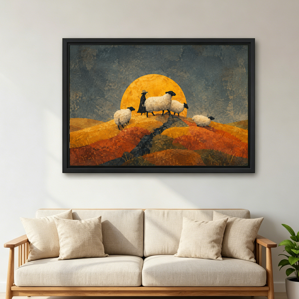 Golden Moon Sheep canvas wall art framed above a cream sofa with wooden arms and a green plant.