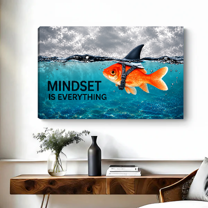 mindset goldfish shark canvas wall art unframed above a live-edge desk beside flowers and dark vase.