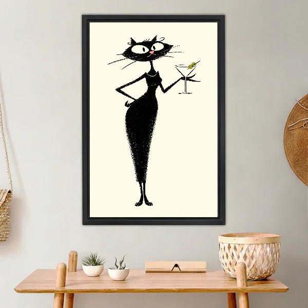 midcentury martini cat canvas wall art framed above a light wood console with cacti and basket.