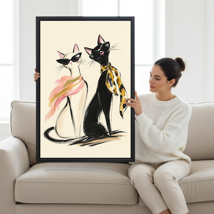 fashion sunglasses cats canvas wall art framed as a seated woman holds the artwork on a pale sofa.
