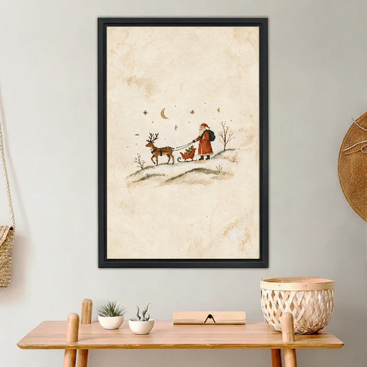 minimalist santa sleigh canvas wall art framed above a light wood console with cacti and basket.