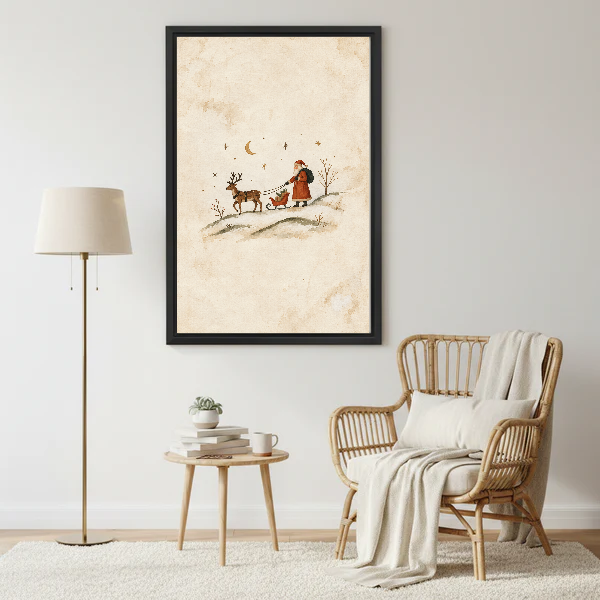 minimalist santa sleigh canvas wall art framed beside a wicker armchair with floor lamp and small table.