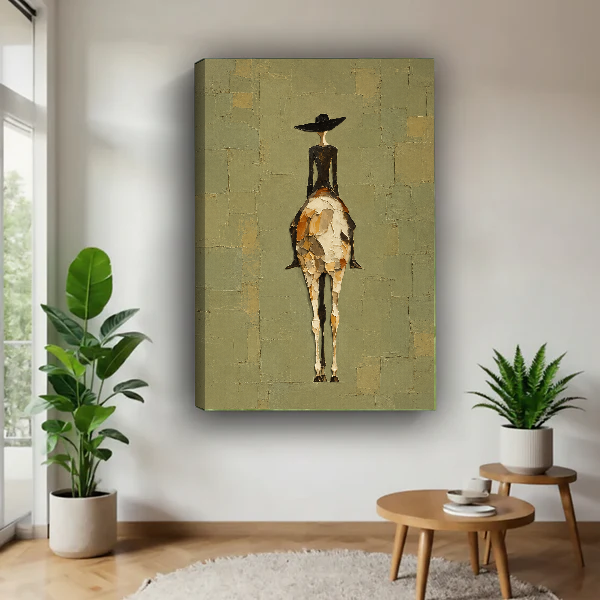 western woman rider canvas wall art unframed above a wooden table beside green plants and stools.