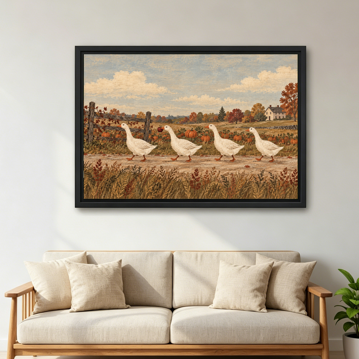 country harvest geese canvas wall art framed above a cream sofa with wooden arms and green plant.