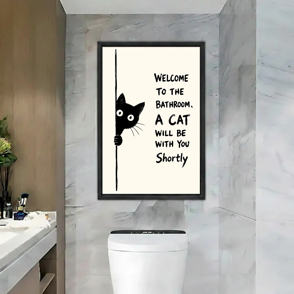 Funny Bathroom Cat Canvas Wall Art framed above a toilet beside marble walls and wood door.