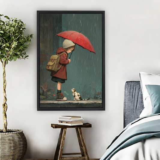 Rainy Day Girl Cat Canvas Wall Art framed beside a blue bed with books and leafy plant.