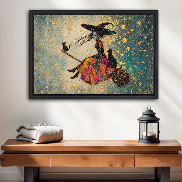 Patchwork Witch and Cats canvas art framed above a wooden table and lantern.