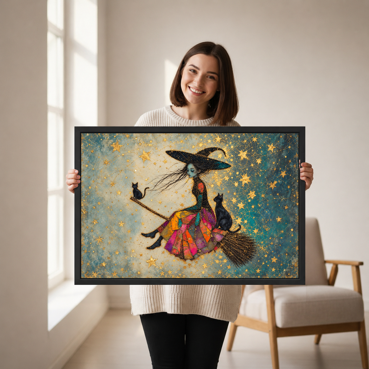 Patchwork Witch and Cats canvas art framed, held by a woman in a neutral room.