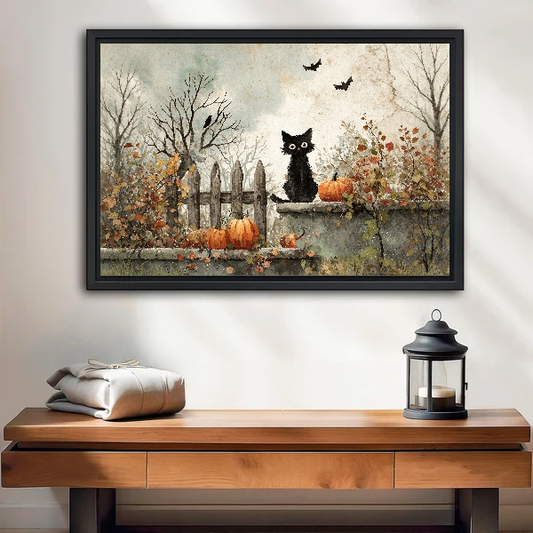 Autumn Garden Black Cat canvas art framed above a wooden table and lantern.