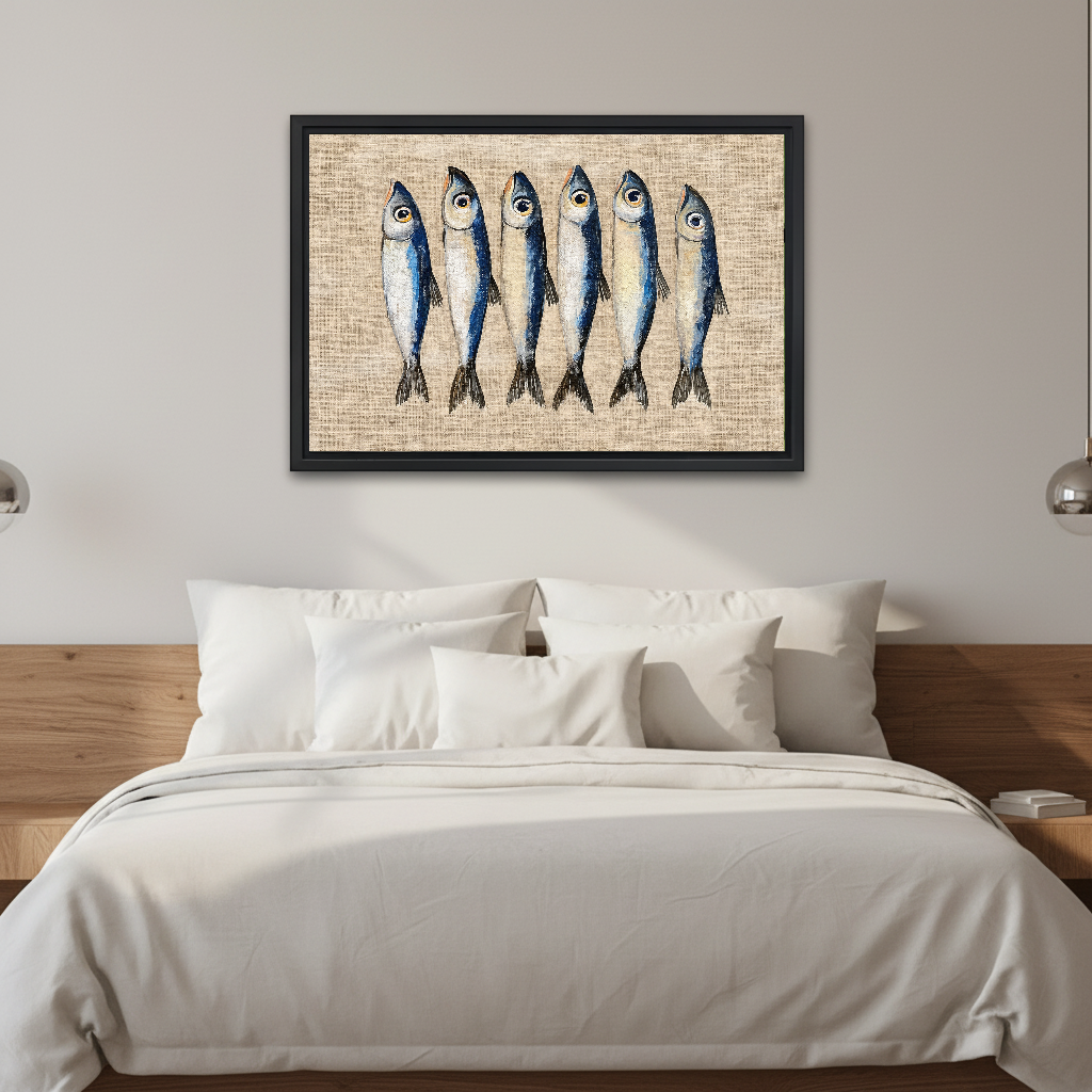Six Curious Blue Sardines canvas art framed above a white bed in a neutral bedroom.