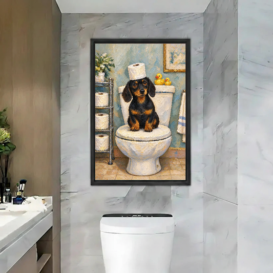 Funny Toilet Dachshund canvas art framed above a white toilet on a marble wall.