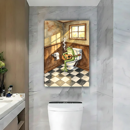 Bathroom Guitar Playing Frog canvas art unframed above a white toilet on a marble wall.
