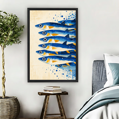 Blue and Gold Swimming Sardines canvas art framed beside a bed with muted blue bedding and a potted tree.