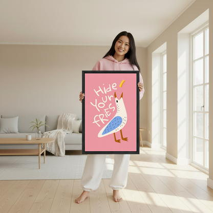 Hide Your Fries Seagull canvas art held framed by a woman wearing pink.
