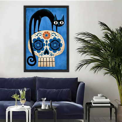 Black Cat Floral Skull canvas art framed above a navy sofa beside a palm.