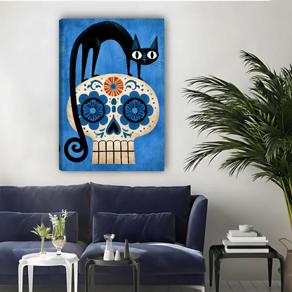 Black Cat Floral Skull canvas art unframed above a navy sofa beside a palm.