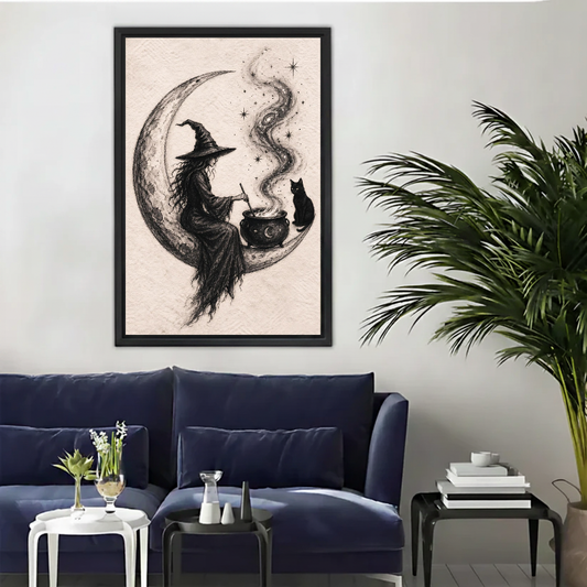 Crescent Moon Witch Cat canvas art framed above a navy sofa beside a palm.