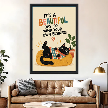 Funny Lounging Cat Canvas Wall Art framed above a brown leather sofa with brass lamp.