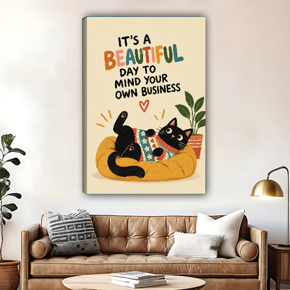Funny Lounging Cat Canvas Wall Art unframed above a brown leather sofa and coffee table.