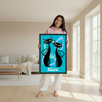 Retro Black Cats Canvas Wall Art held in a black frame by a woman wearing pink.