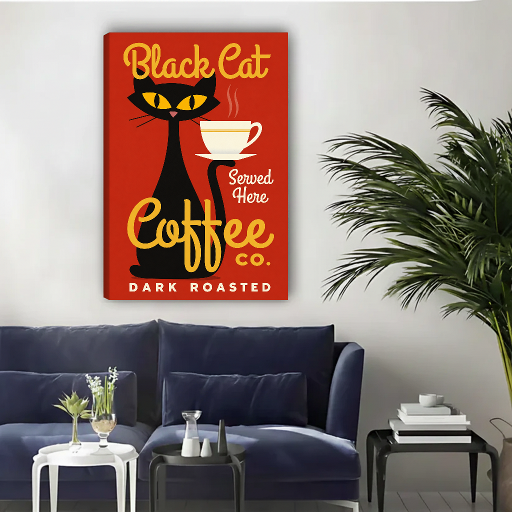 Black Cat Coffee Canvas Wall Art unframed above a navy sofa with light wall and palm.