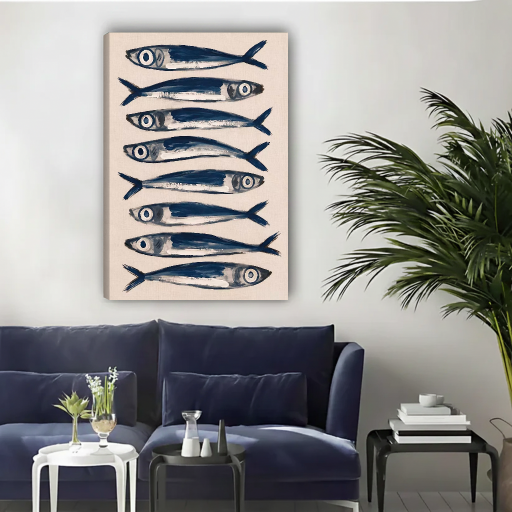 Blue Sardines Canvas Wall Art unframed above a navy sofa and nested side tables.