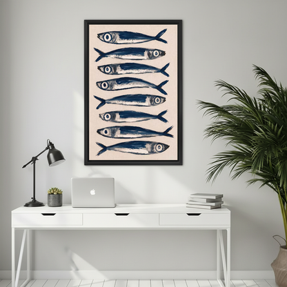 Blue Sardines Canvas Wall Art framed above a white desk with laptop and black lamp.