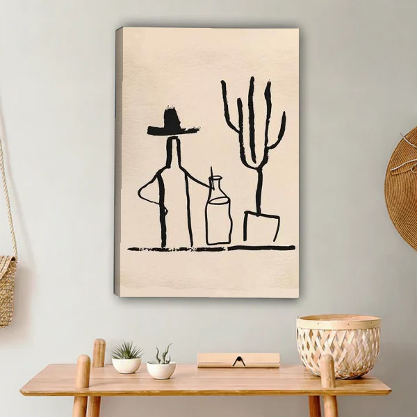 Cowboy Cactus Canvas Wall Art unframed above a light wood console and woven basket.