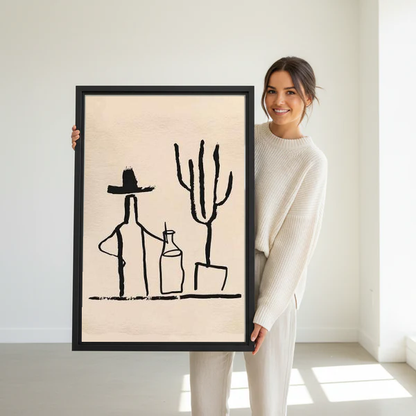 Cowboy Cactus Canvas Wall Art held in a black frame by a standing woman in white.