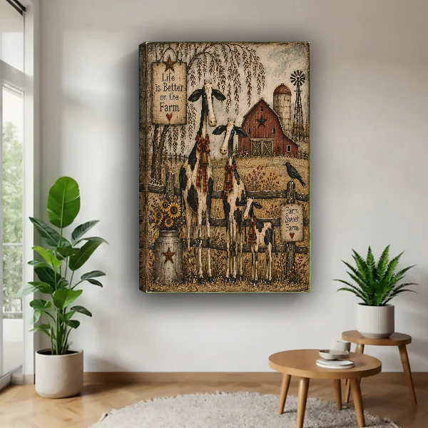 Farm Cow Family Canvas Wall Art unframed above a wood table with green plants.