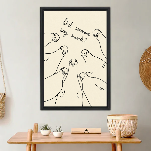 Snack Pigeons Canvas Wall Art framed above a light wood console with cacti.