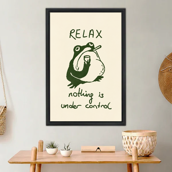 Relax Frog Canvas Wall Art framed above a light wood console with cacti.