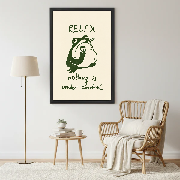 Relax Frog Canvas Wall Art framed beside a wicker armchair with floor lamp.