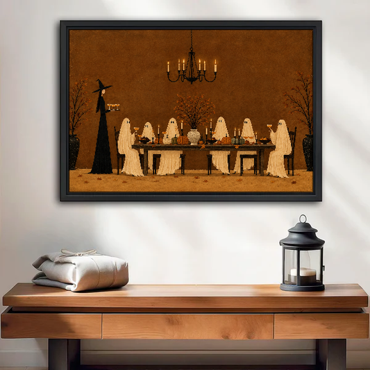 Ghost Dinner Canvas Wall Art framed above a wood console with linen and a lantern.