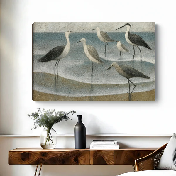 Coastal Gulls Canvas Wall Art unframed above a wooden console with simple vases.