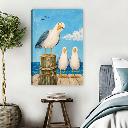 Seagull Trio Canvas Wall Art unframed beside blue bedding and a leafy plant.