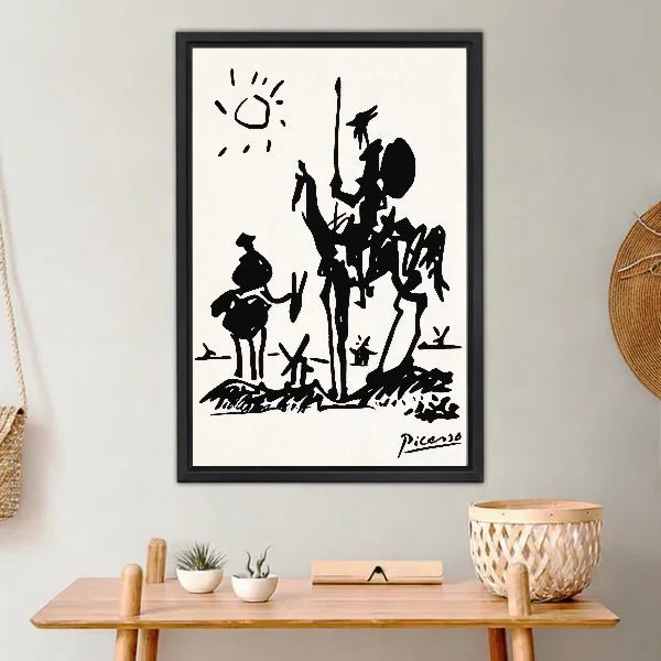 Don Quixote Canvas Wall Art framed above a light wood console with cacti.