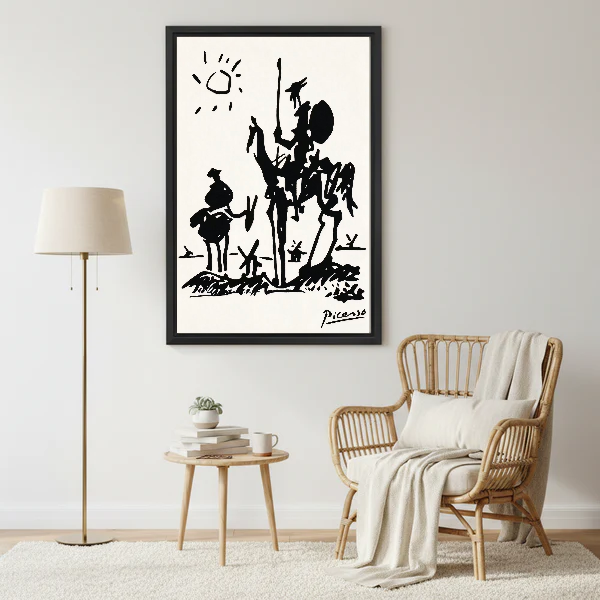 Don Quixote Canvas Wall Art framed beside a wicker armchair with floor lamp.