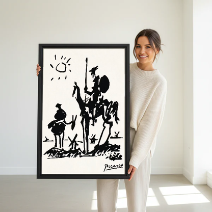 Don Quixote Canvas Wall Art held in a black frame by a standing woman in white.