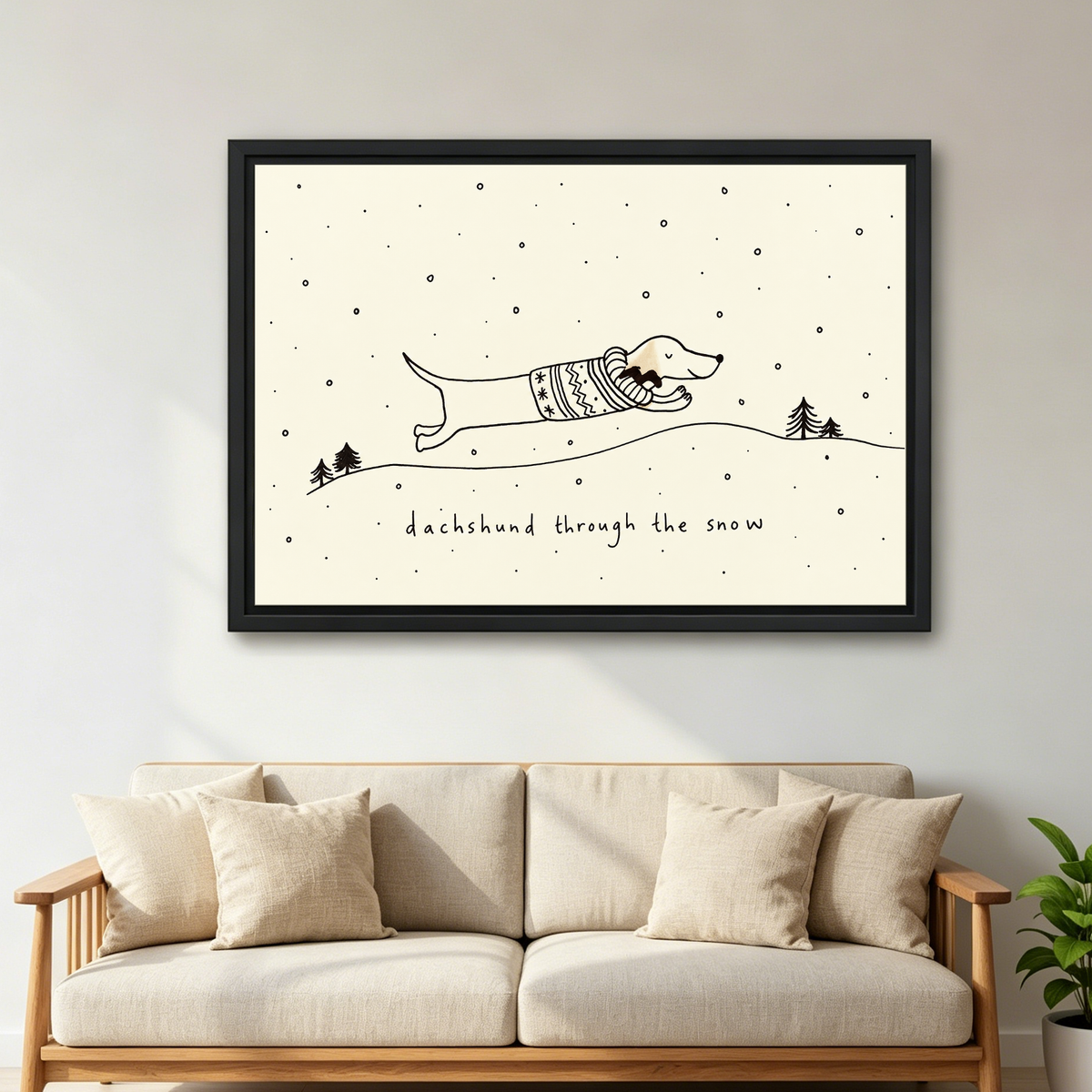 Dachshund Snow Canvas Wall Art framed above a cream sofa with wooden arms.