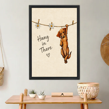 Hang In There Canvas Wall Art framed above a light wood console with cacti.