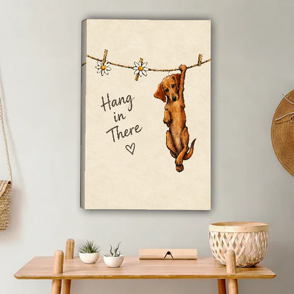 Hang In There Canvas Wall Art unframed above a light wood console and woven basket.