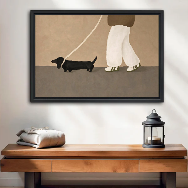 Dachshund Stroll Canvas Wall Art framed above a wood console with linen and a lantern.