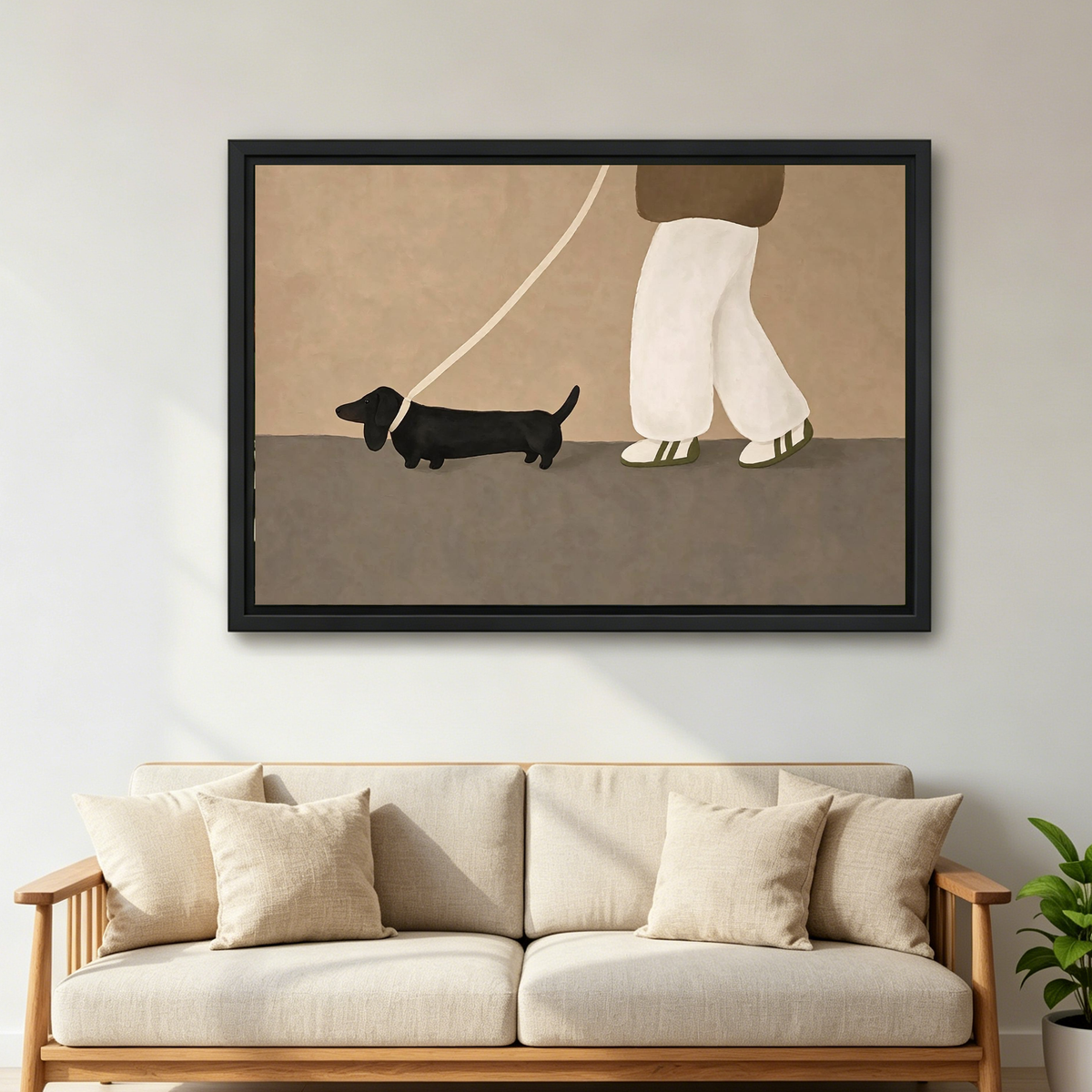 Dachshund Stroll Canvas Wall Art framed above a cream sofa with wooden arms.