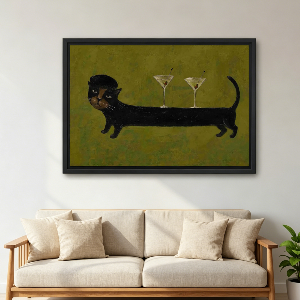 Cocktail Cat Canvas Wall Art framed above a cream sofa with wooden arms.