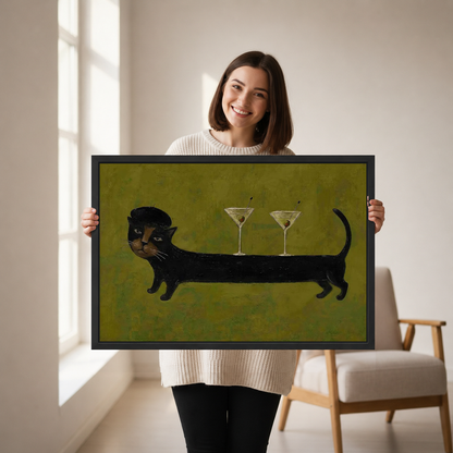Cocktail Cat Canvas Wall Art held in a black landscape frame by a standing woman.