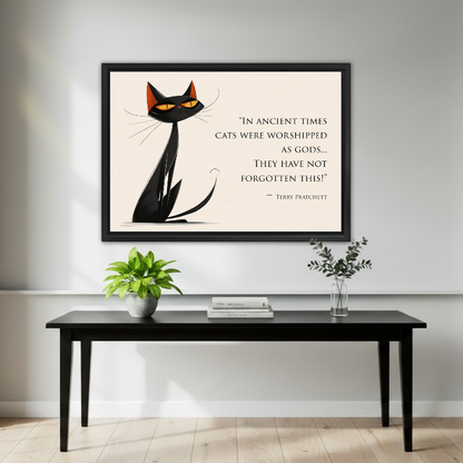 Cat Quote Canvas Wall Art framed above a black console with small green plants.