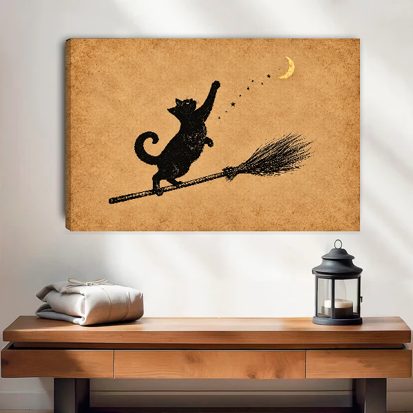 Moon Cat Canvas Wall Art unframed above a wood console with linen and a lantern.