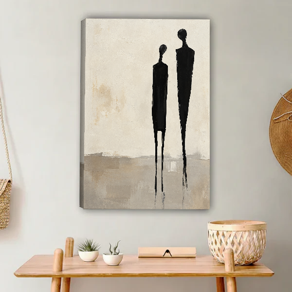 Minimalist Couple Canvas Wall Art unframed above a light wood console and woven basket.