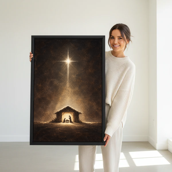 Starlit Nativity Canvas Wall Art held in a black frame by a standing woman in white.